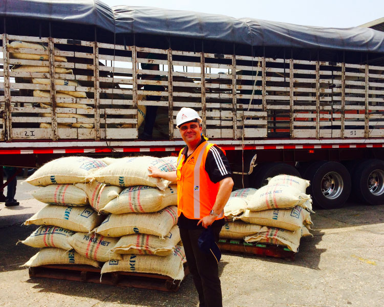 Gerd Müller-Pfeiffer in the port city of Cartagena in Colombia loading coffee sacks