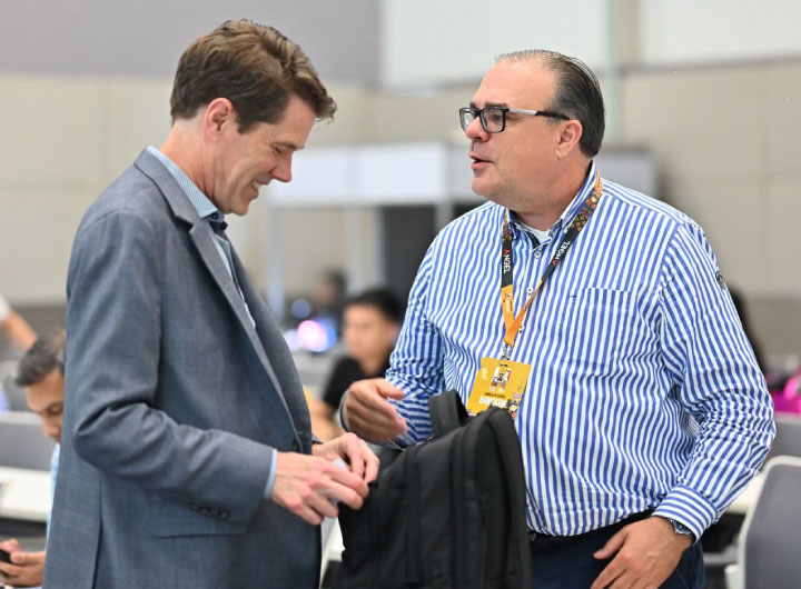 Gerd Müller-Pfeiffer in conversation with a participant at World of Coffee Asia Bangkok 2026